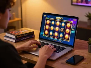 Engaging in SHBET online gaming with laptop, showing slot game interface and tips for responsible gambling.